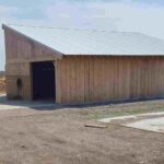 Composter shed beside manure pad